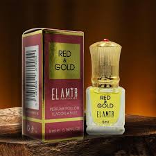 extracto de perfume rojo y dorado
